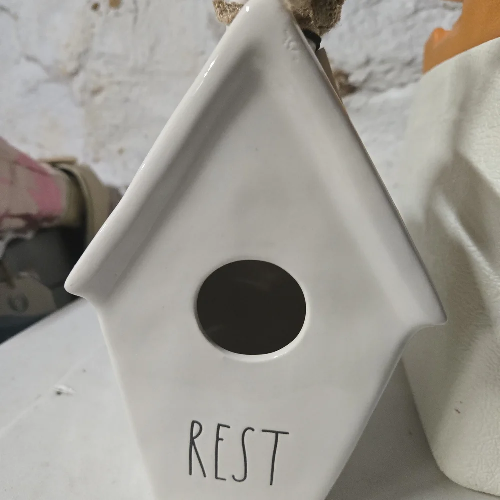 White Ceramic Birdhouse with 'Rest' Inscription